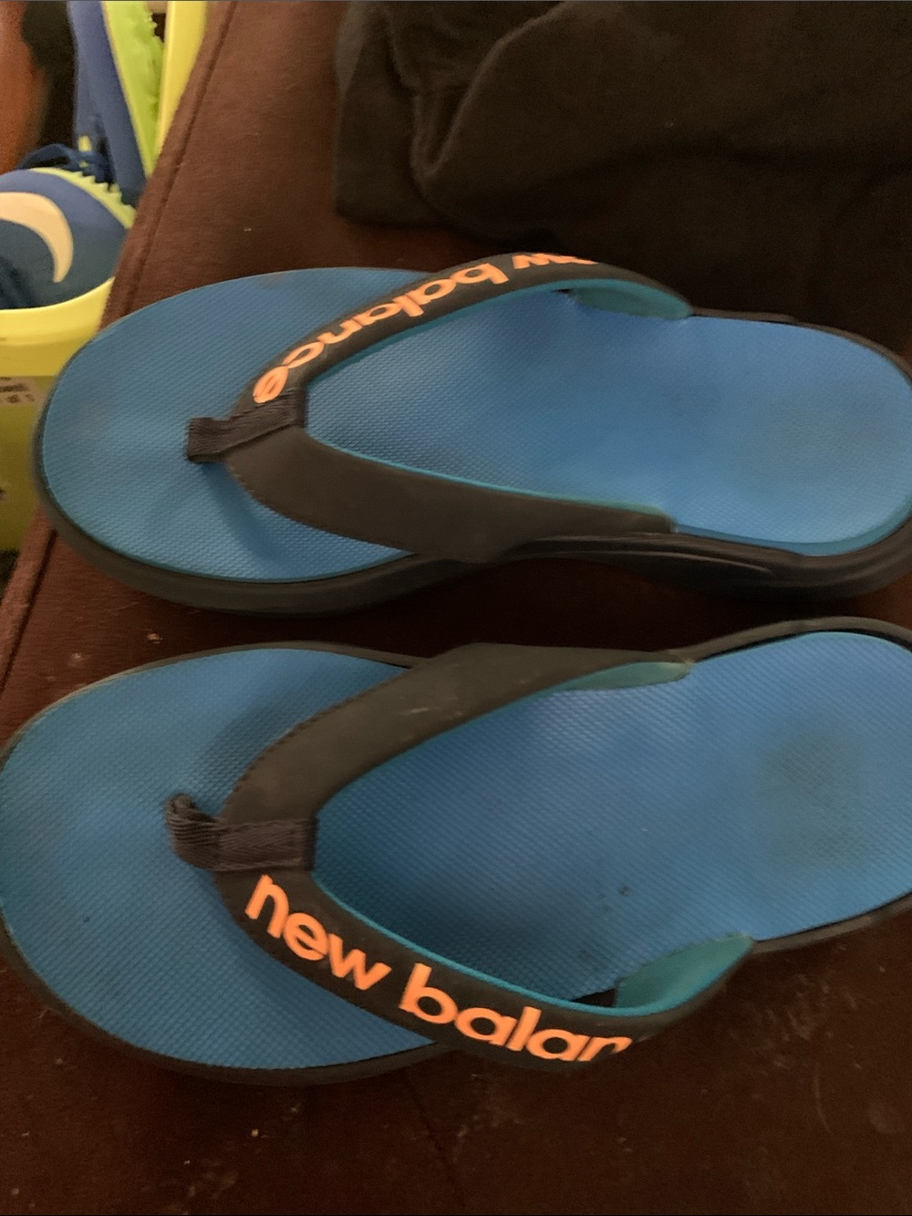New Balance Blue and Black Flip Flops with Orange Logo